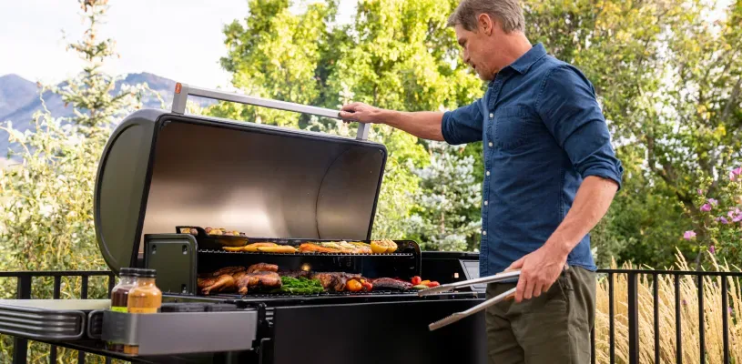 man-grilling-using-traeger-ironwood
